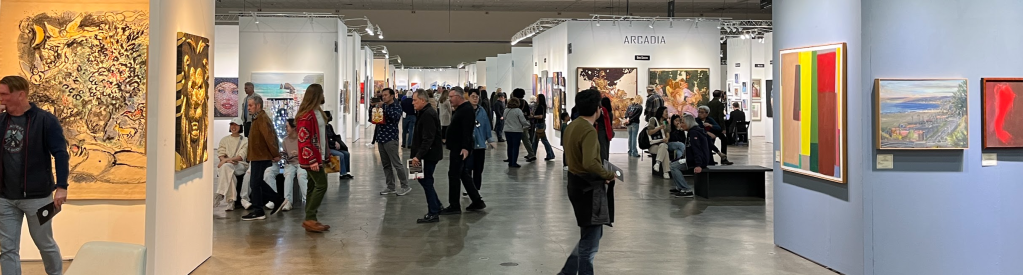 Crowds look at art.